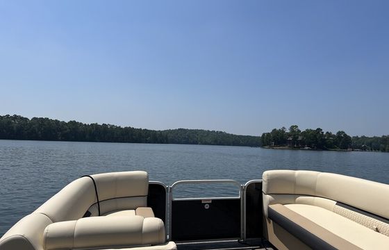Enjoy beautiful Lake Martin on this like-new 23ft Godfrey Sweetwater