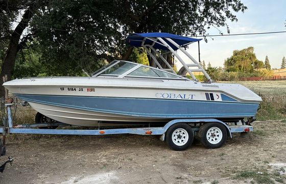 Experience the thrill of wake surfing on a classic 1989 Cobalt
