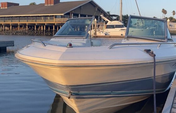 Experience the thrill of wake surfing on a classic 1989 Cobalt