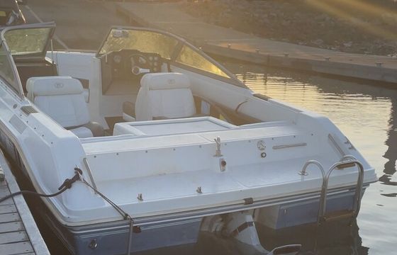Experience the thrill of wake surfing on a classic 1989 Cobalt