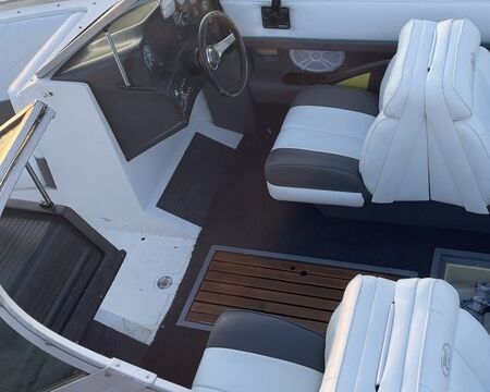 Experience the thrill of wake surfing on a classic 1989 Cobalt