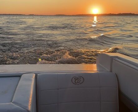 Experience the thrill of wake surfing on a classic 1989 Cobalt