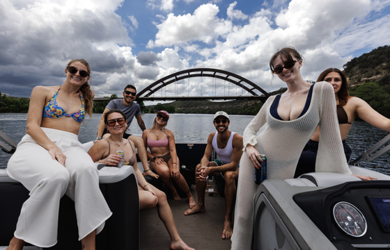 Double deck pontoon boat with slide on Lake Austin
