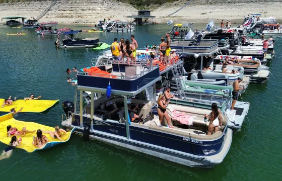 Double Decker Party Boat with a Waterslide and Lily Pad on Lake Travis