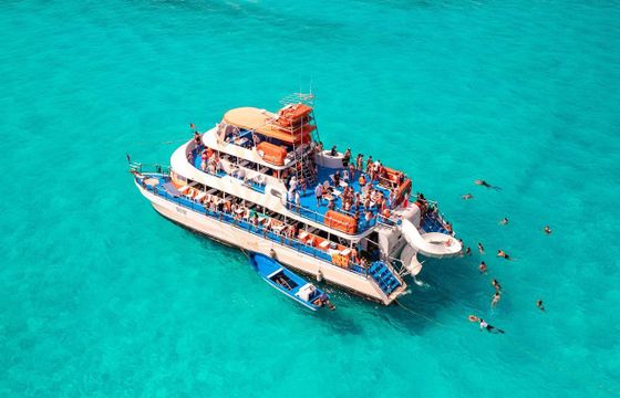 77 ft Catamaran Cruise With Drinks, food and Waterslide In Cancún, Mexico