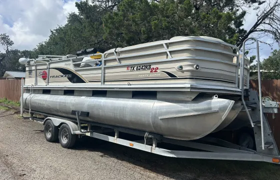 This Sun Tracker Party Barge at Canyon Lake … runs good but upholstery is weak.