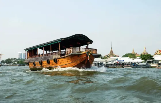 Cocktail Party on the River in Bangkok with a Traditional Thai Rice Barge