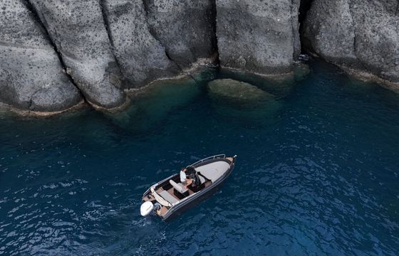 santorini black boat