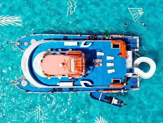 77 ft Catamaran Cruise With Drinks, food and Waterslide In Cancún, Mexico