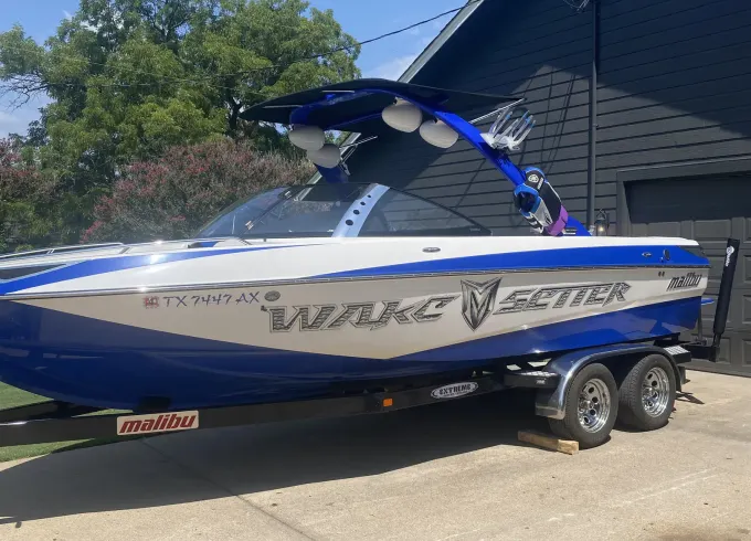 Malibu wakesetter 23’.   Gas included and captain wakeboards surf board jackets.