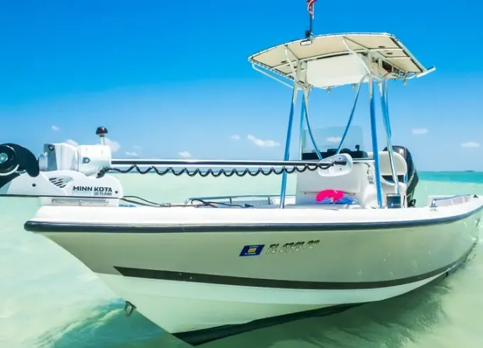 "Piano Piano" Triton 218 Bay Explorer Center Console Rental located in Naples, Florida