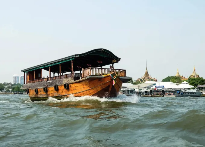Cocktail Party on the River in Bangkok with a Traditional Thai Rice Barge