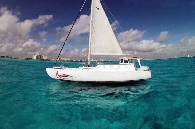 Cheers to the Seas: 37ft Catamaran Charter in Cancún with Open Bar Options!