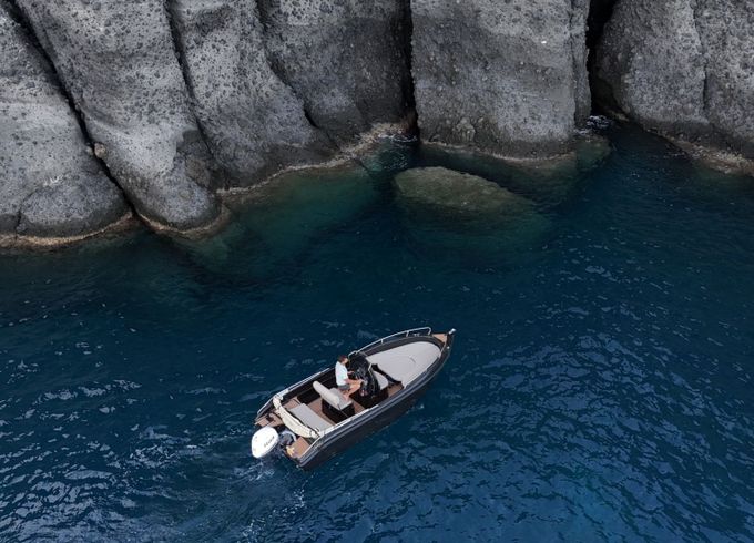santorini black boat